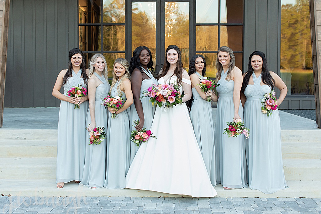 bridesmaids in grey dresses at the luminaire